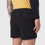 Aerotex Distance Run Short in black, worn by model showing back pocket detail and fit