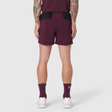 Aerotex Distance Run Short in merlot, rear view on model wearing matching tank and socks