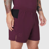 Aerotex Distance Run Short in merlot worn by model, side view showing pocket detail