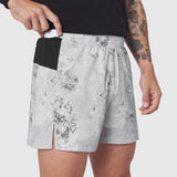 Aerotex Distance Run Short in Sedona Snow Camo worn by model, front view with hand in pocket