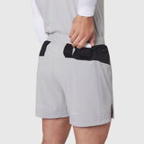 Aerotex Distance Run Short in slate grey, worn by model with hand in back pocket