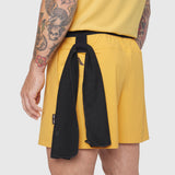 TETRA-LITE® 5" Linerless Training Short in Amber, model wearing shorts with black towel