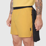 TETRA-LITE® 5" Linerless Training Short in amber and black, worn by model, side view