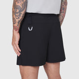 Black TETRA-LITE training shorts on model, side view showing 5" inseam and back pocket