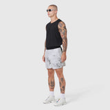 Tetra-Lite 5" Linerless Training Short in Sedona Snow Camo, worn with black sleeveless top