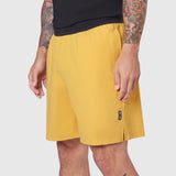 TETRA-LITE® 7" Linerless Training Short in amber yellow, worn by model, side view