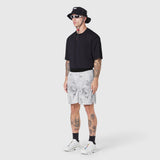 TETRA-LITE 7" Linerless Training Short in Sedona Snow Camo, worn with black tee and white sneakers