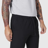 Black TETRA-LITE Training Jogger worn by model, side view detail of waistband and pocket