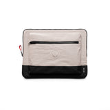 flatlay of Ripstop Laptop Bag in chai and black, front view showing zipper pocket and logo