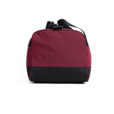 Flatlay 1234 Ripstop Duffle Bag in crimson and black, front view