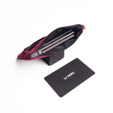 Flatlay 1235 Ripstop Clip Bag in crimson, open view with contents