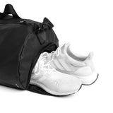 Flatlay Water Resistant Barrel Duffle Bag 45L in black with white sneakers