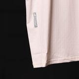 SM'22 Outlast® Base Layer Cutoff in cream, detail shot of sleeve and branding label
