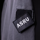 SP'20 Garment-Dyed Patch Hoodie in charcoal gray, detail shot of ASRU branded patch on sleeve
