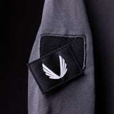 SP'20 Garment-Dyed Patch Hoodie in grey with black embroidered patch detail, worn on model