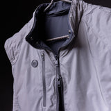 SP'22 Reversible Run Vest in light gray and navy, displayed on hanger showing front detail