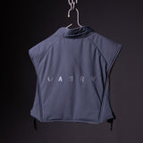 flatlay SP'22 Reversible Run Vest in navy blue, back view on hanger against dark background