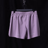 flatlay WN'23 6" Perforated Short in lavender purple, back view