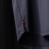 WN'23 Established Tee detail shot showing red triangle logo on dark navy fabric