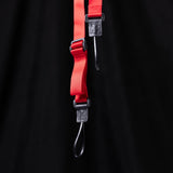 flatlay WN'19 Camera Strap in red and black, overhead view against dark background