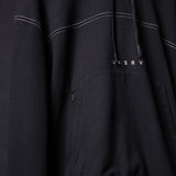 FA'20 Contrast Thread Hoodie in black with white stitching detail, draped fabric closeup