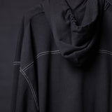 FA'20 Contrast Thread Hoodie in black with white contrast stitching, worn on model