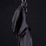 Black full zip training hoodie on model, hanging from chain, side view