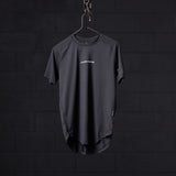 SM'22 Established Tee in charcoal gray, displayed on hanger against dark background