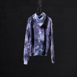 SM'22 Tie Dye Hoodie in purple tie dye, displayed on hanger against dark background