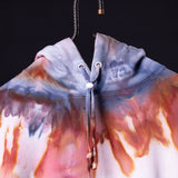 SM'22 Tie Dye Hoodie in blue and coral gradient, front view on model