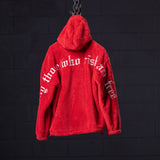 WN '23 Sherpa Recovery Hoodie in red, displayed on chain against dark background, back view