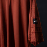 SM'23 Mesh Oversized Jersey in rust red, draped detail shot showing fabric texture and ASRV label