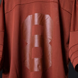 SM'23 Mesh Oversized Jersey in rust red, worn on model showing front detail and draping
