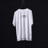 SM'23 Oversized Logo Tee in white, displayed on hanger against dark background