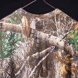 flatlay FA'23 Rocker Cutoff tee in tan with forest and birch tree graphic print, front view