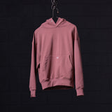 Pink Tech Terry Eagle Hoodie displayed on hanger against dark background, back view