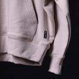WN'23 Waterproof Panel Hoodie in mauve, close-up detail of sleeve and logo label