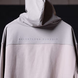 WN'23 Waterproof Panel Hoodie in light gray, worn with hood up, front view