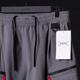 flatlay WN'23 Tetra™ City Pant in grey on hanger with tag, front view