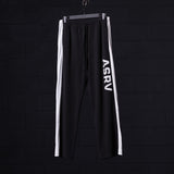 flatlay of ASRV SM'24 Waffle Knit Sweat Pant in black with white stripe, front view