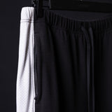 SM'24 Waffle Knit Sweat Pant in black, detail shot of fabric texture and waistband