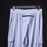flatlay WN'22 Cargo High Rib Jogger in light blue, back view