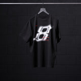Black Tech Essential Relaxed Tee with glowing graphic design on hanger, front view