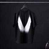 Black Tech Essential Relaxed Tee with white graphic design, back view on hanger