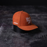 flatlay SM'23 Valley of Fire Low Pro Hat in rust orange, front angled view