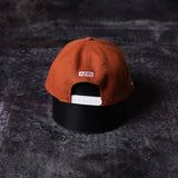 flatlay SM'23 Valley of Fire Low Pro Hat in rust orange and black, back view