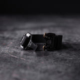 flatlay WN'20 Cobra® Buckle Bracelet in black with metal hardware, top view