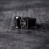 flatlay WN'20 Cobra Buckle Bracelet in black with bronze hardware, front view