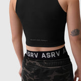 Black ribbed mockneck tank worn with camo shorts, front view on model with lotus tattoo