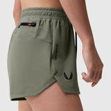 Tetra-Lite Linerless Short in sage worn by model, side view showing pocket detail